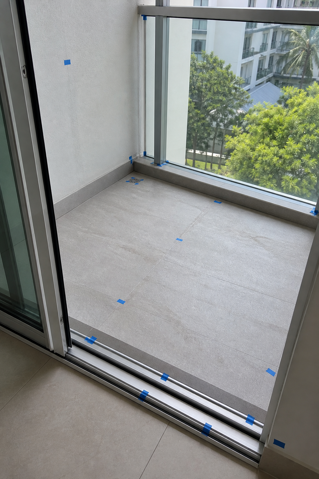 Balcony inspection — defects marked with blue tape