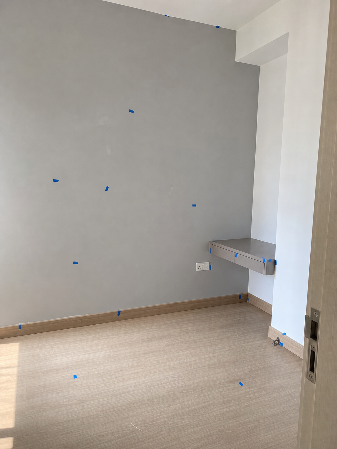 Bedroom inspection — defects marked with blue tape