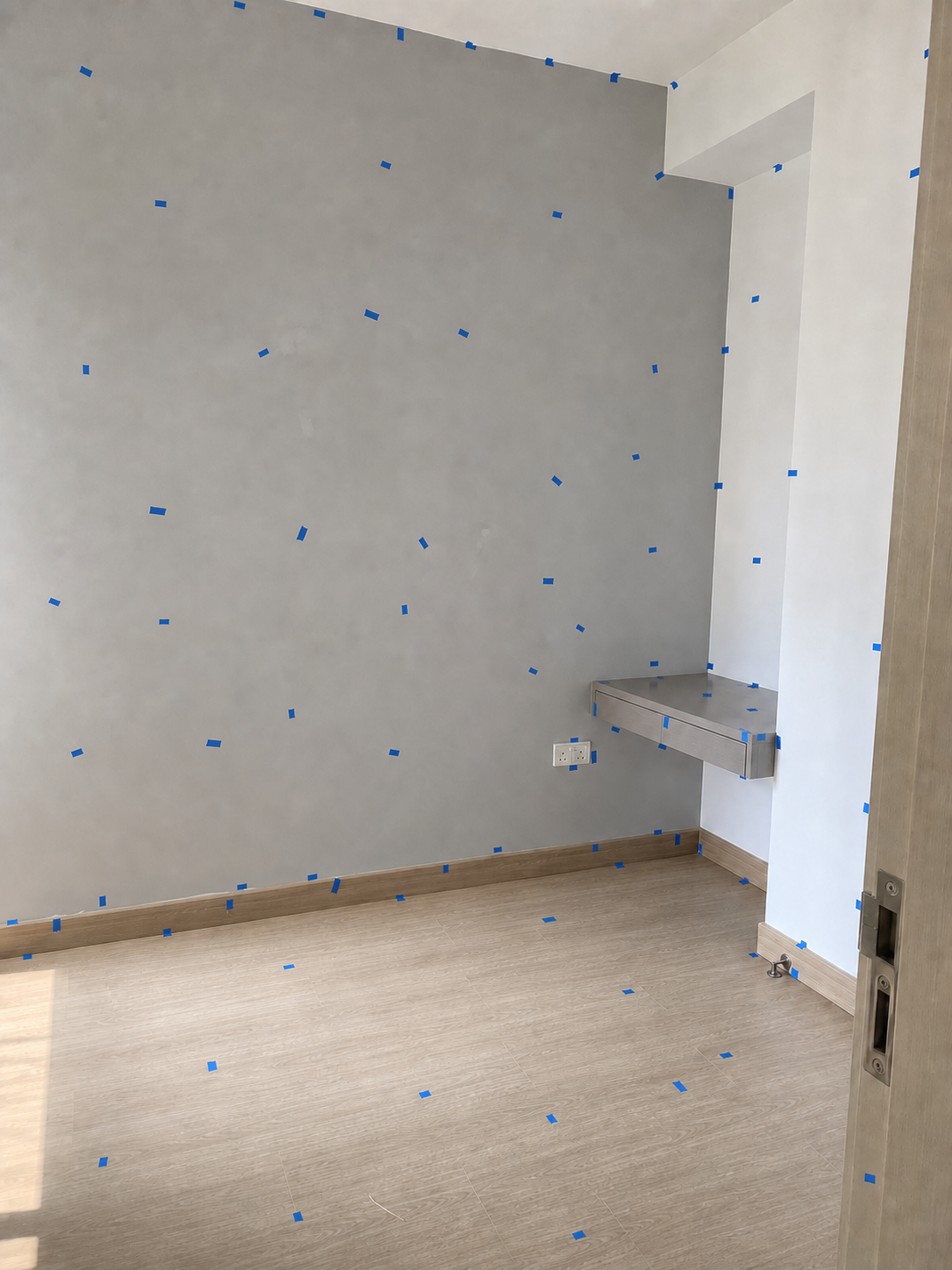 Bedroom inspection — defects marked with blue tape